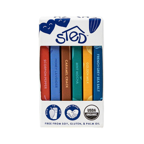 Chocolate bar gift set with six colorful mini bars, flavors labeled. White box with logo and icons.