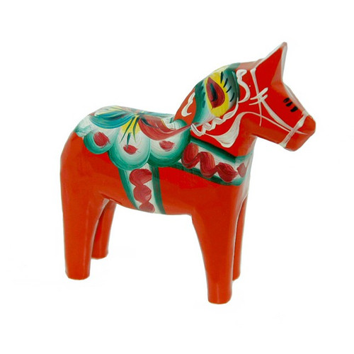 Red wooden Dala horse figurine with painted floral details; side view.