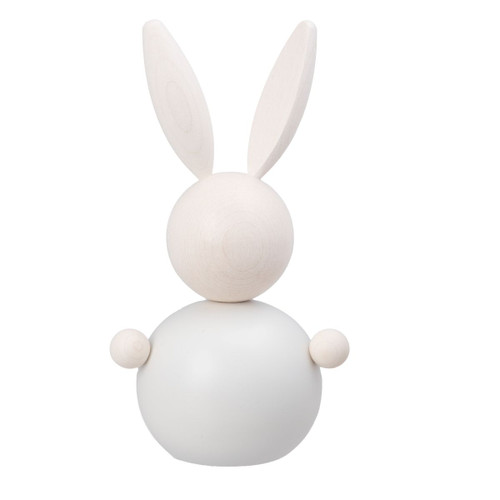 White wooden rabbit figurine with long ears and round body.