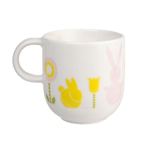 White ceramic mug with spring bunny and flower designs.