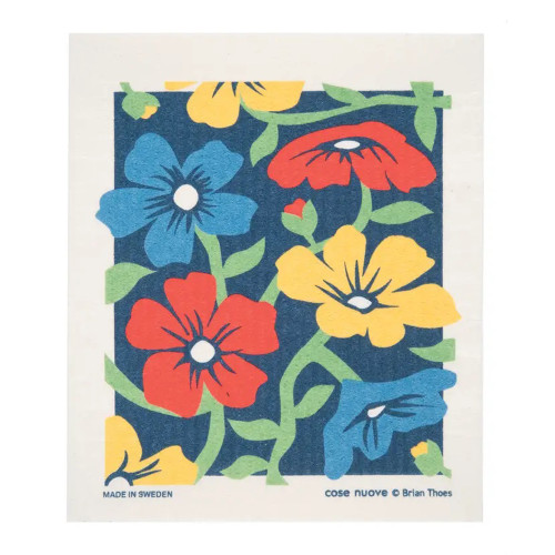 Swedish dishcloth with a floral pattern. Blue, red, and yellow flowers on a dark blue background.