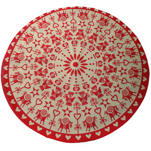 Red and beige jute tree mat with Scandinavian folk art pattern. Circular, top-down view.