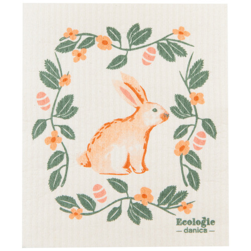 Orange bunny in a floral wreath on a cream-colored Swedish dishcloth.