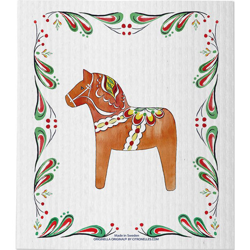 Brown Dala horse with red, green, and yellow floral border on white cloth.