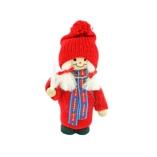 Swedish tomte girl figurine in a red knit hat and sweater holding a white candle.