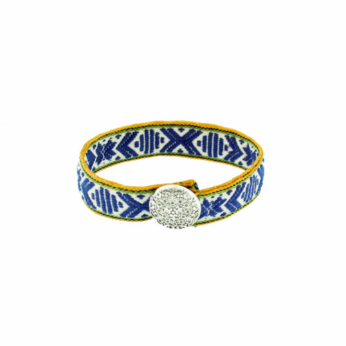 Navy, white, and green woven Swedish braid bracelet with a silver button.