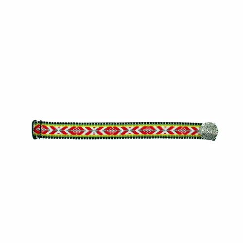 Flatlay of red Sami braid bracelet with geometric embroidery and silver button.