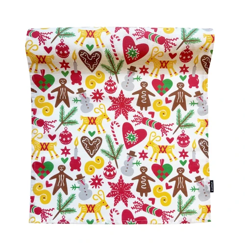 Bengt & Lotta's white Klippan God Jul table runner with red, yellow, and green holiday motifs.