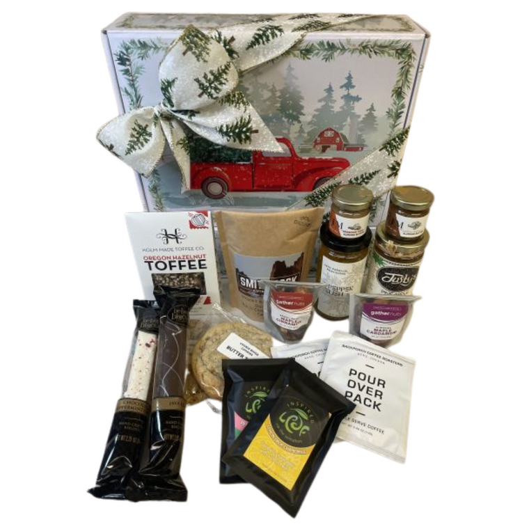 Taste of Central Oregon Holiday Gift Box includes JEM Organics - espresso almond butter 1.27oz jar Bend), JEM Organics - cinnamon maca almond butter 1.27oz jar Bend) Jelly pineapple pepper jelly - mild (Redmond), 45th Parallel Provisions - 3 pepper relish (Bend) Holmmade Toffee Co. Candy Cane Chocolate Toffee (Bend), Backporch Coffee Roasters - 2 pour coffee single serve packs (Bend), Inspired Leaf Teas - Peppermint herbal loose leaf tea, chamomile loose leaf tea (Bend), Bebop Biscotti - Peppermint Crush, Java biscotti (Redmond), Gather Nuts - maple cinnamon brazil nuts, maple cardamom almonds (Bend), Smith Rock Coffee Roasters - Misery Ridge Blend (Redmond), Cookie Binge - fresh baked oatmeal cranberry jumbo cookie and butter toffee jumbo cookie (Bend).  Designed in a holiday themed gift box. 