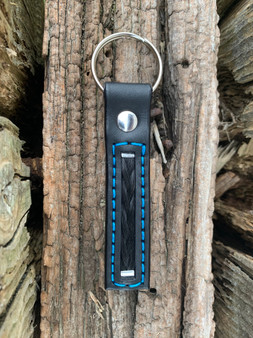 Black leather with bright blue stitching nickel plate hardware round