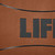 14" x 20" Orange and Black "Life" Rectangular Outdoor Throw Pillow