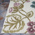 5.25' x 7.5' Ivory and Purple Floral Rectangular Outdoor Area Trow Rug