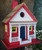 8.75" Red and White Capitola Cottage Outdoor Garden Birdhouse
