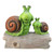 14.5" Green and Brown Mom with Baby Snail on a Tree Stump Outdoor Garden Statue