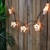 10-Count White and Black Cow Patio Light Set, 6ft Green Wire