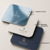 Rounded-square business cards showing vibrant gloss, writable uncoated and smooth matte finishes