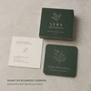 Green and cream square business cards comparing sharp corners with rounded corners