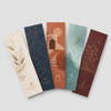 Five custom premium bookmarks with botanical, geometric, architectural, watercolor, and literary designs arranged on a white background.