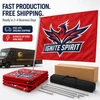 Red Ignite Spirit flag displayed with folded flags, sectional poles, carrying bags, shipping box, and delivery truck.