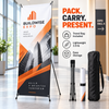 Portable X-frame banner stand with an orange BuildWise Expo graphic, folded hardware, rolled banner, and black travel bag.