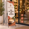 Custom Ember and Oak X-frame banner displayed outside a coffee shop for retail promotions and increased foot traffic.