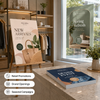 Bulk posters displayed in a retail store for new arrivals, seasonal promotions, and a denim sales event.