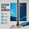 Blue double-sided city-themed pole banner displayed with mounting brackets, steel bands, fasteners, poles, and rolled printed material.
