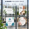 Horizontal, vertical, square, and circular custom window clings displayed together across four glass panels.