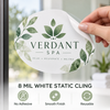 Hand peeling an oval Verdant Spa window cling from glass to demonstrate its removable static-cling material.
