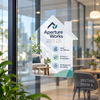 House-shaped Aperture Works window decal promoting office spaces, privacy, and professional branding on meeting-room glass.
