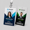 Two custom plastic employee identification tags with full-color photos, names, barcodes, and clear lanyard attachments.