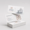Custom uncoated business cards featuring architectural branding on natural white cardstock.