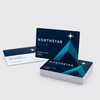 Stack of dark blue Northstar Club membership cards with teal geometric artwork, shown from the front and back.