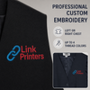 Close-up of colorful Link Printers logo embroidered on a black professional dress vest