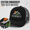 Custom embroidered trucker cap featuring a detailed Summit Outdoors mountain logo and breathable gray mesh panels.