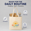 Natural lightweight tote bag with a colorful Bright Day Co. logo, holding notebooks and a reusable bottle.