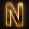 Illuminated rear halo lighting on custom gold mirror channel letters at night