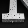 Close up of starry sky multi size punch hole laser cut pattern on metal letter