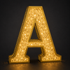 Brilliant sparkling crystal diamond illumination on luxury sign letter at night