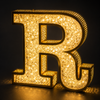 Brilliant sparkling crystal diamond illumination on luxury sign letter at night