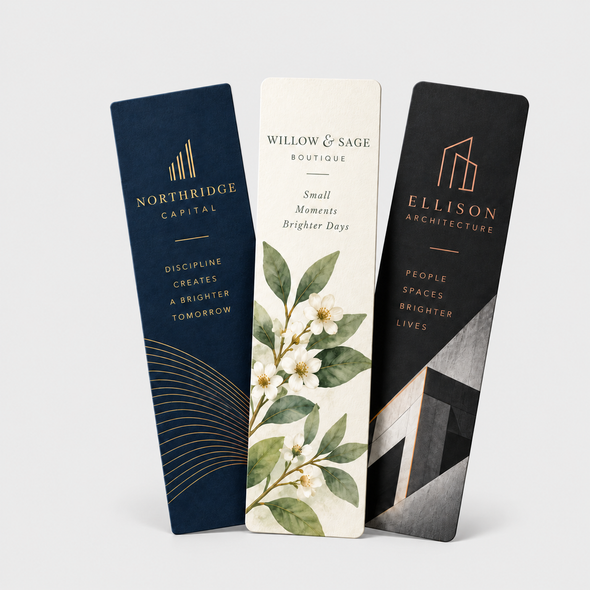 Three ultra premium bookmarks with navy, floral, and black architectural designs displayed upright on a light background.