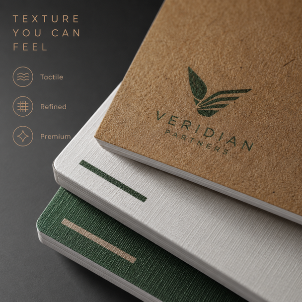 Close-up of stacked Kraft, white, and green business cards showing refined tactile paper textures
