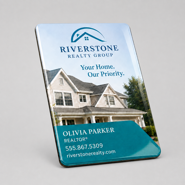 Glossy rectangular postcard magnet featuring Riverstone Realty Group branding, a house photo, realtor contact details, and rounded corners.