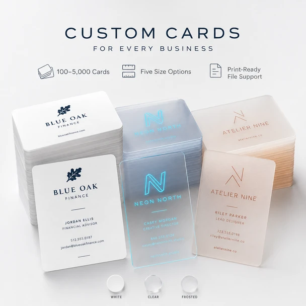 Stacks of custom business cards shown in white, clear blue, and frosted plastic finishes.