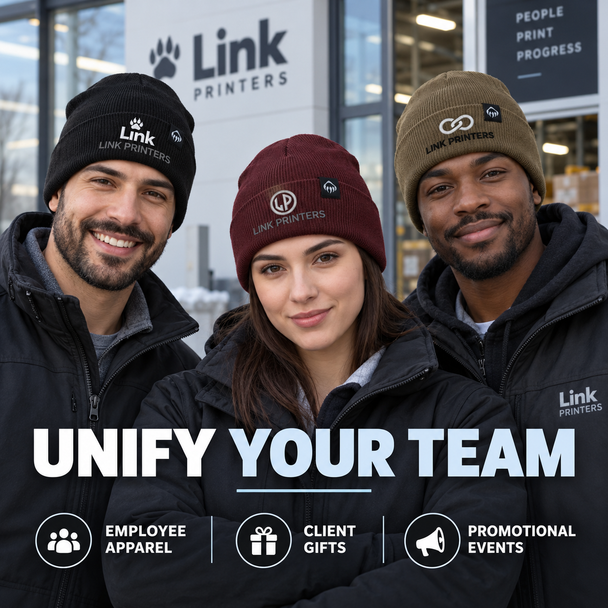 Three employees wearing coordinated custom embroidered Wolverine® beanies for team apparel and promotions.