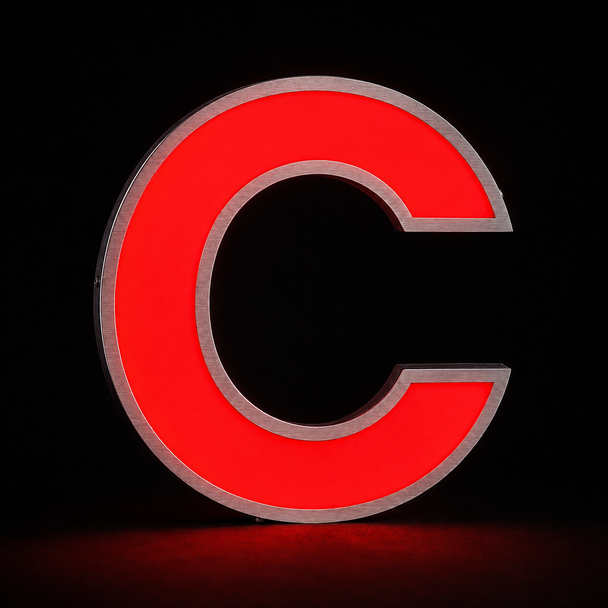 Illuminated front-lit acrylic face on stainless steel channel letters at night