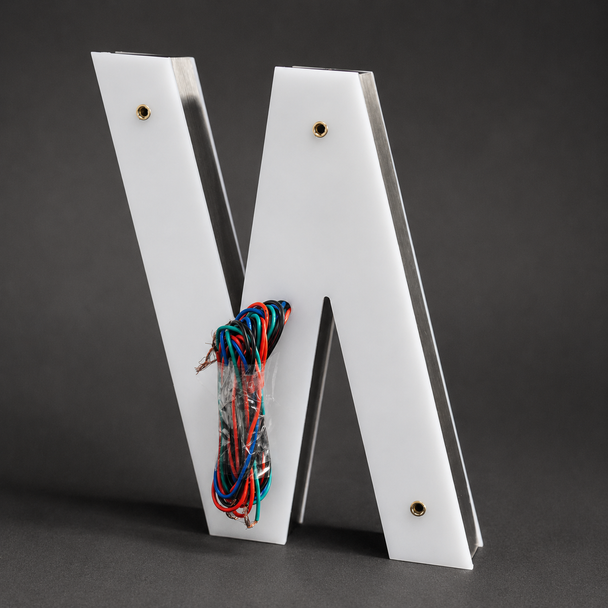 Cast acrylic front face and rear light diffusing acrylic back on 3D letter