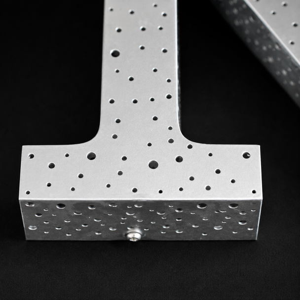 Close up of starry sky multi size punch hole laser cut pattern on metal letter