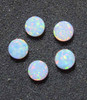 Opal dots OP17 7 x 1.3mm flat pcs made to specific diameter and thickness made from manufactured opal suitable for inlay, fretboard markers, jewellery, Opal dots can be worked same way as mother of pearl and are of similar hardness.