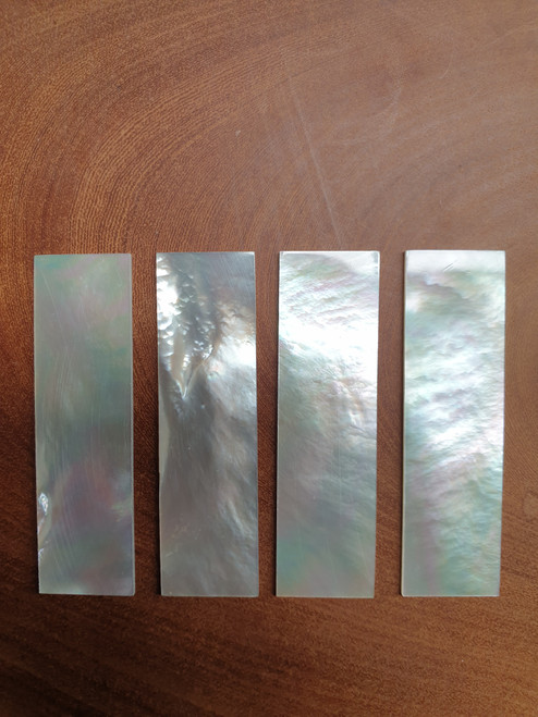 White Mother of Pearl flat inlay blanks polished 1 side size 19mm (0.75") width x 67.1mm (2.64") length x 1.5mm (0.06") thickness A grade clean on both sides.